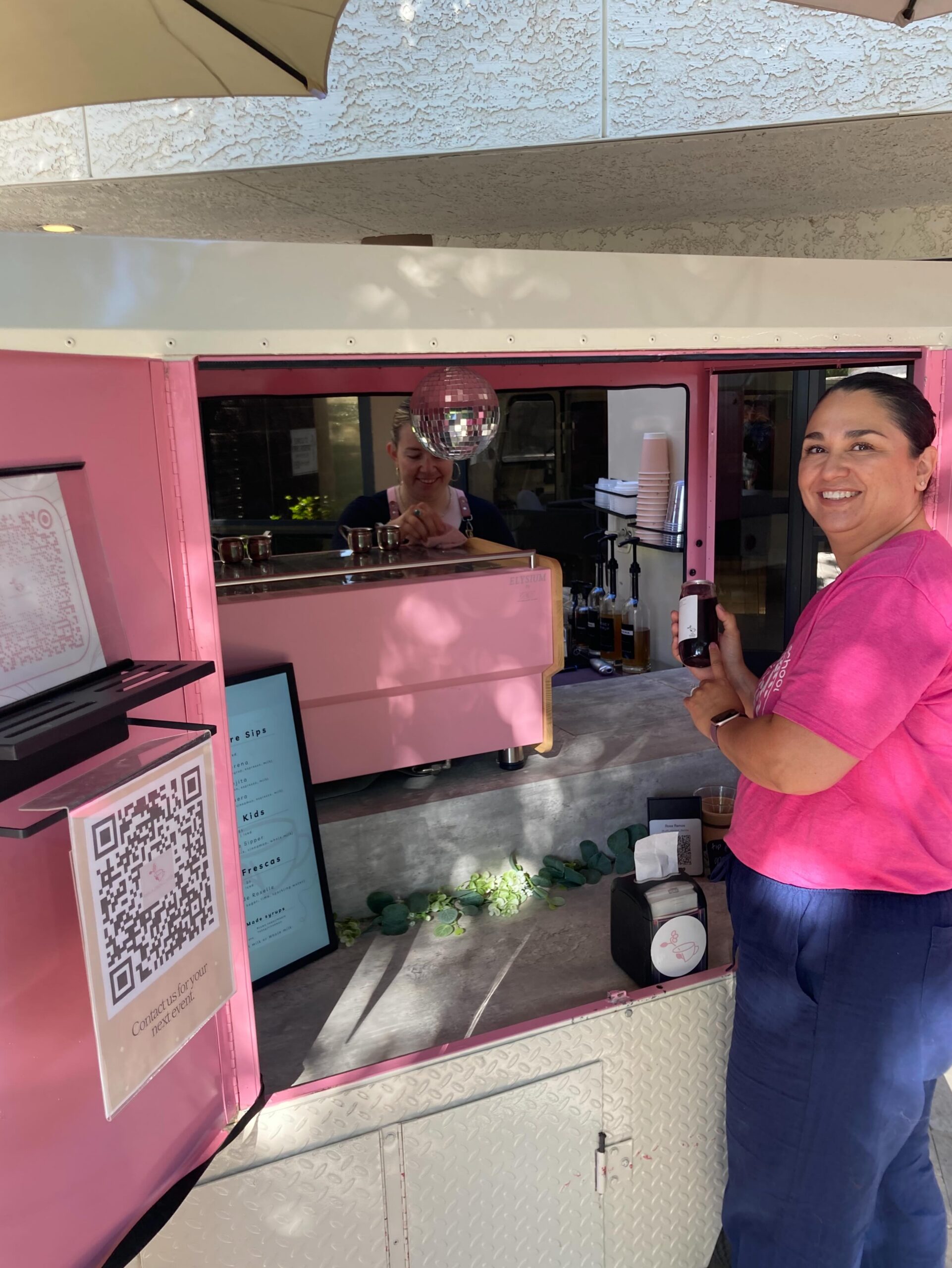 Rosa with the pink cart at an event